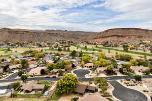 Aerial perspective of suburban area with a mountain backdrop