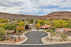 Aerial view of residential area featuring a mountainous background