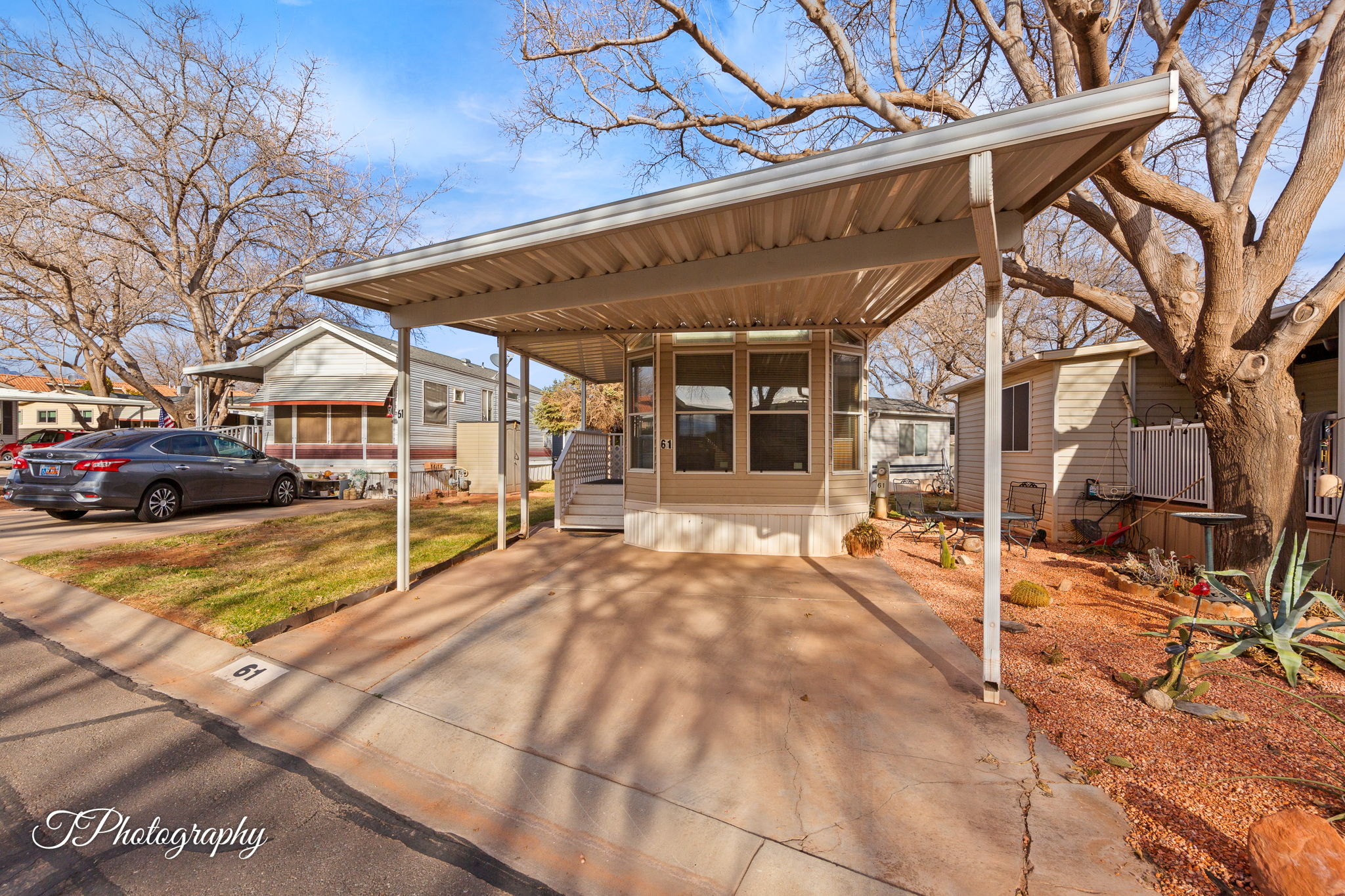 View of front of home with a carport