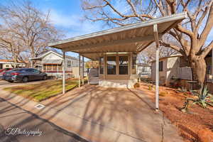View of front of home with a carport