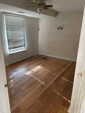 Unfurnished room featuring hardwood / wood-style flooring and ceiling fan
