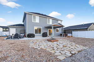 Back of house with a patio, a fenced backyard, and stucco siding