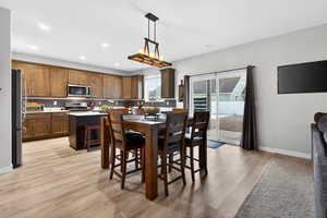 Dining area featuring light wood-style flooring and recessed lighting