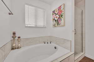 Full bath with a garden tub and a stall shower