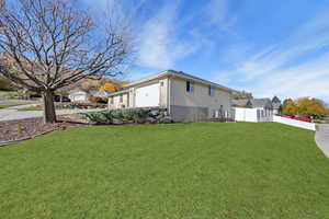 View of side of property featuring brick siding