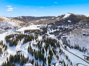 Snowy aerial view with a mountain view