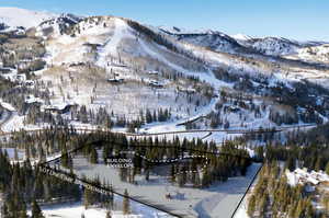 Snowy aerial view featuring a mountain view