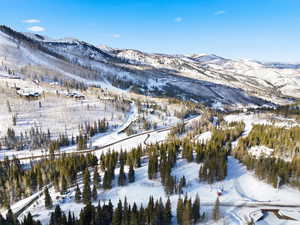 Snowy aerial view with a mountain view