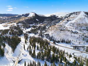 Snowy aerial view featuring a mountain view