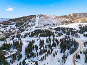 Snowy aerial view with a mountain view
