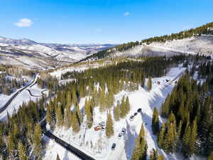 Snowy aerial view featuring a mountain view