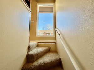 Staircase with a  picturesque window