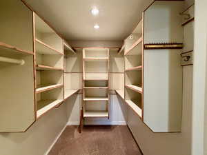 Spacious primary bedroom's closet with shelves to organize all your needs