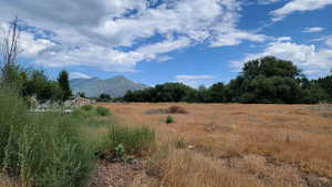 View of mountain background featuring rural landscape