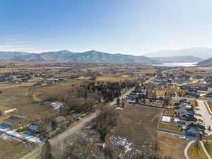 Aerial perspective of suburban area featuring a mountainous background