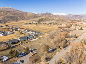 Aerial overview of property's location featuring nearby suburban area and rural landscape