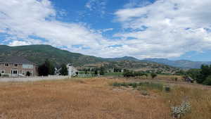 View of mountain backdrop with rural landscape