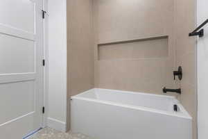 Bathroom featuring shower / bath combination
