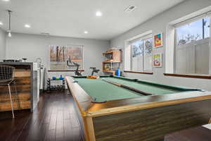 Recreation room with billiards table, plenty of natural light, recessed lighting, and dark wood finished floors