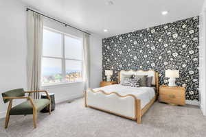Carpeted bedroom with an accent wall, wallpapered walls, and recessed lighting