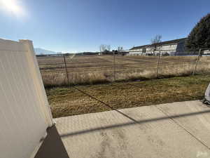 View of yard with a patio area and a view of rural / pastoral area