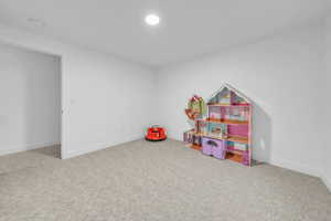 Playroom with carpet and baseboards