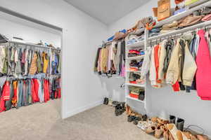 Spacious closet with carpet flooring