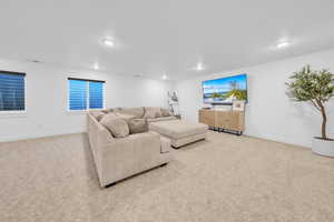 Living room featuring light carpet and recessed lighting