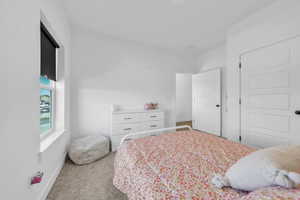 Bedroom with carpet and baseboards