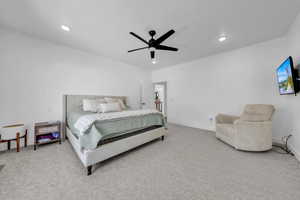 Carpeted bedroom with ceiling fan and recessed lighting