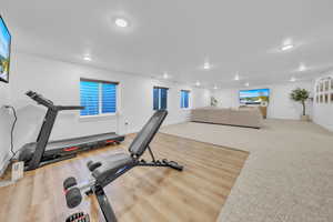 Exercise area with light wood-type flooring