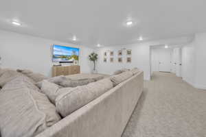 Living room featuring light carpet and recessed lighting