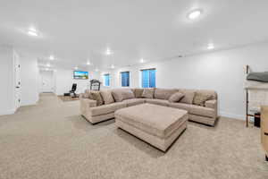 Living room with light carpet and recessed lighting