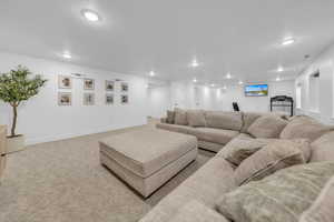 Living area featuring recessed lighting and carpet floors