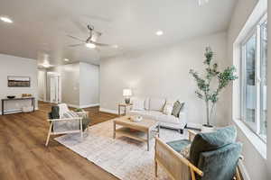 Living area featuring wood finished floors, recessed lighting, and ceiling fan
