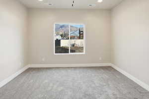 Unfurnished room with light carpet and recessed lighting