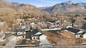 Aerial perspective of suburban area with a mountainous background