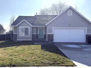 Ranch-style home featuring stucco siding, concrete driveway, an attached garage, and a shingled roof