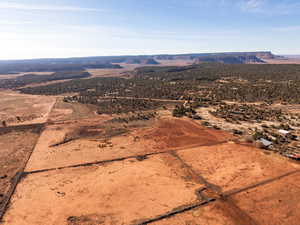Overview of rural landscape featuring a mountain backdrop