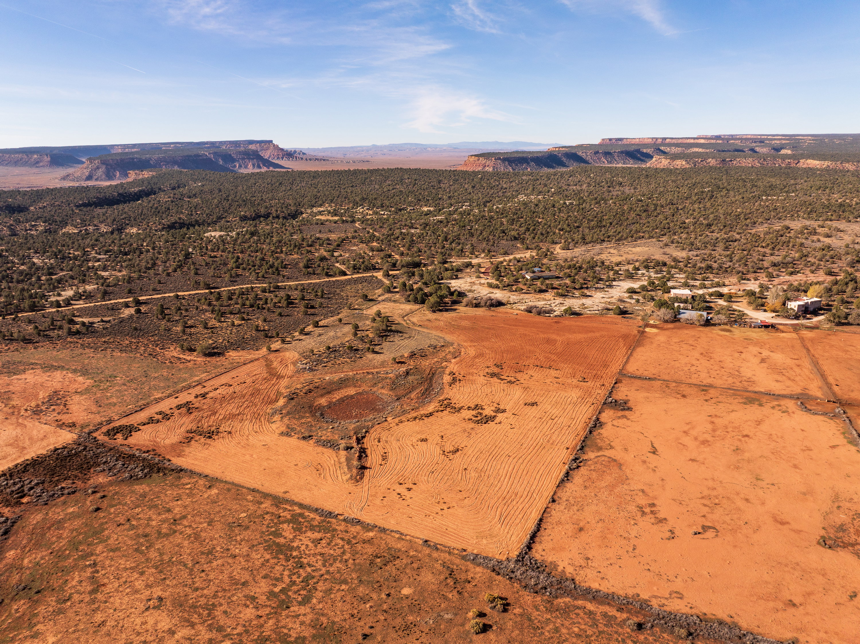 View of rural area with a desert landscape and a mountain backdrop