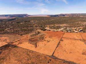 View of rural area with a desert landscape and a mountain backdrop