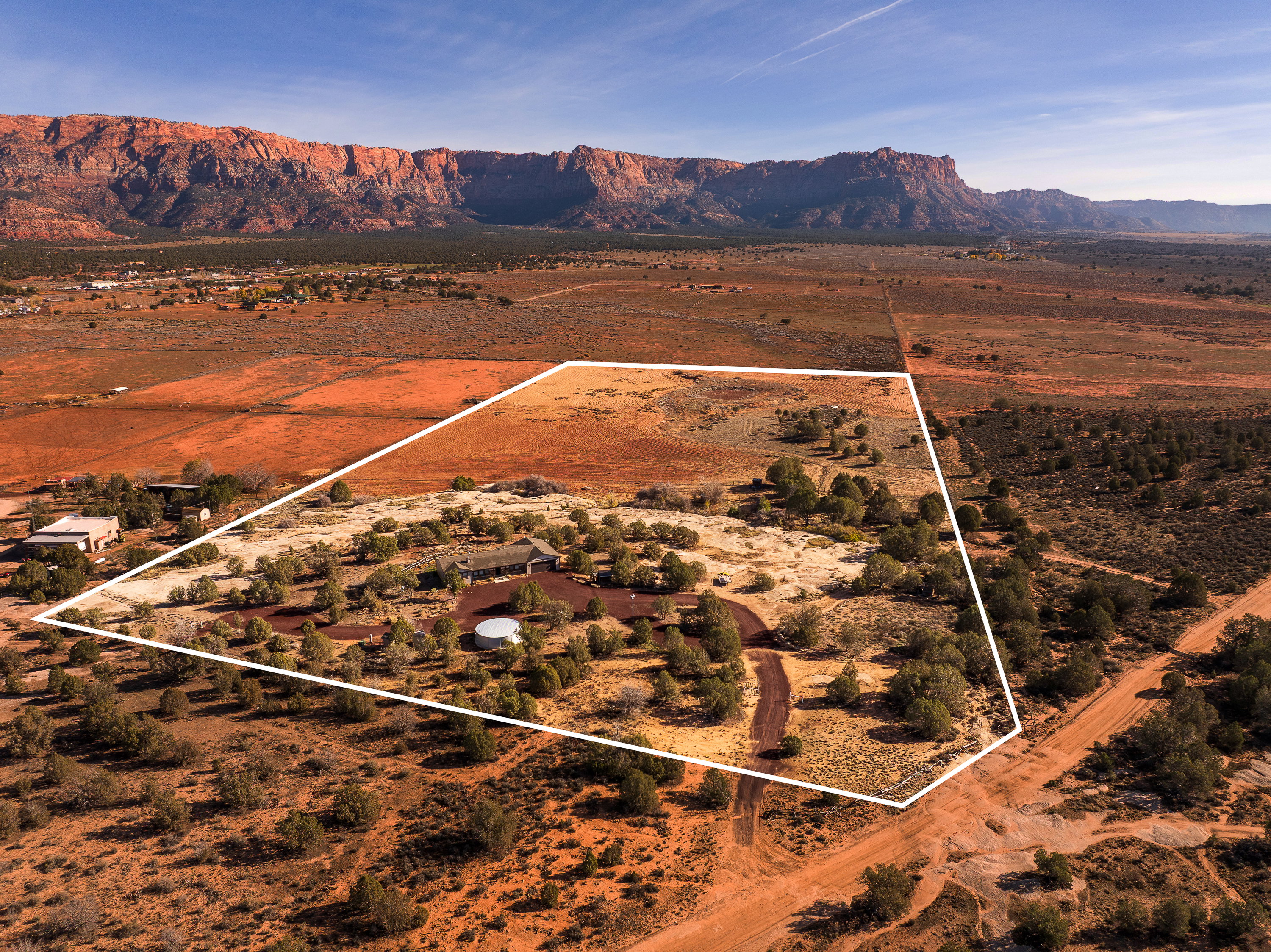 Aerial overview of property's location featuring rural landscape and property boundaries highlighted