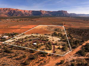 Aerial overview of property's location featuring rural landscape and property boundaries highlighted