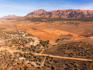View of mountain backdrop with rural landscape and a desert landscape