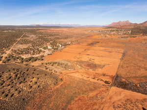 Overview of rural landscape with a mountainous background and a desert landscape