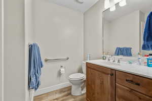 Bathroom featuring vanity and light wood finished floors