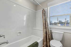 Full bath with shower / tub combo and toilet