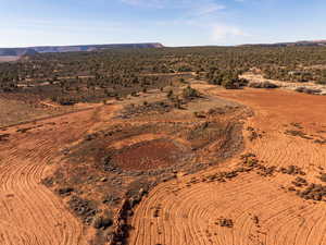 View of rural area with a desert landscape and a mountainous background