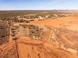 View of rural area with a desert landscape and a mountain backdrop