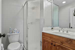 Bathroom with vanity and a shower stall